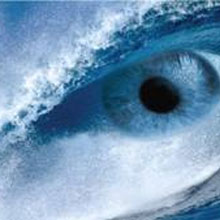 large blue eye in blue waves 