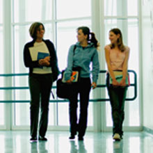 girls walking in school corridor