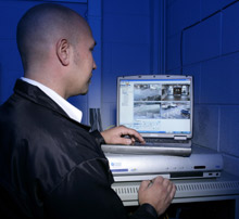 An engineer from Oracle Vision checks an SD DVR at Huddersfield Technical College