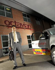 Sukhi Ghuman, CEO of Octavian Security, with patrol car