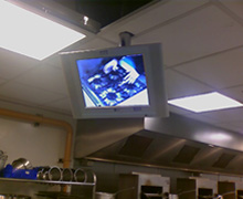 Individual monitors above each students work area