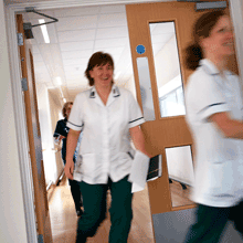 Nurses rushing through hospital doors