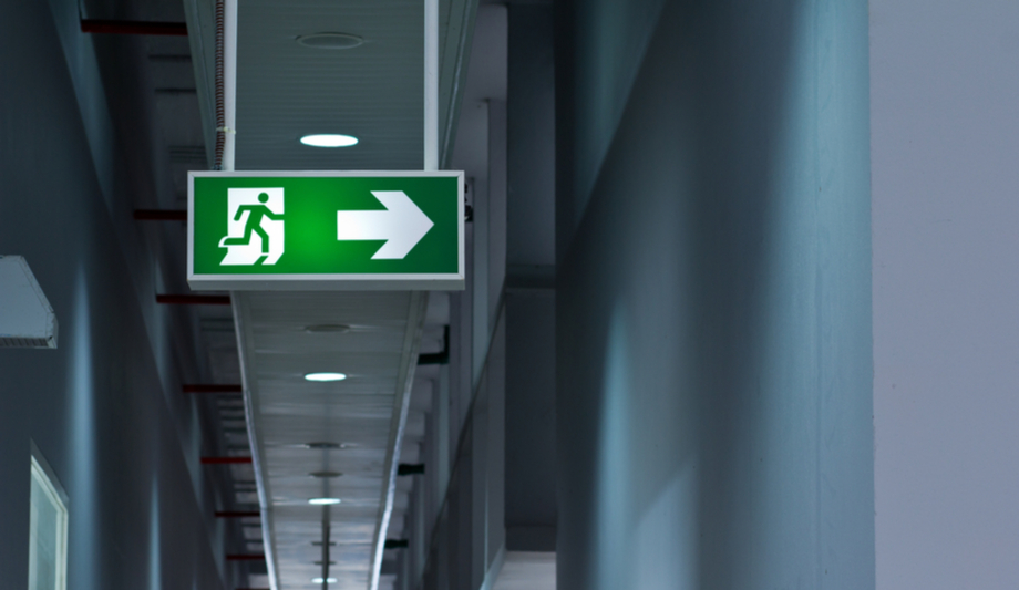 What is the role of security systems in case of fire or other emergency?